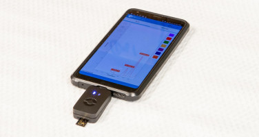Hand-held device reads levels of cancer biomarker